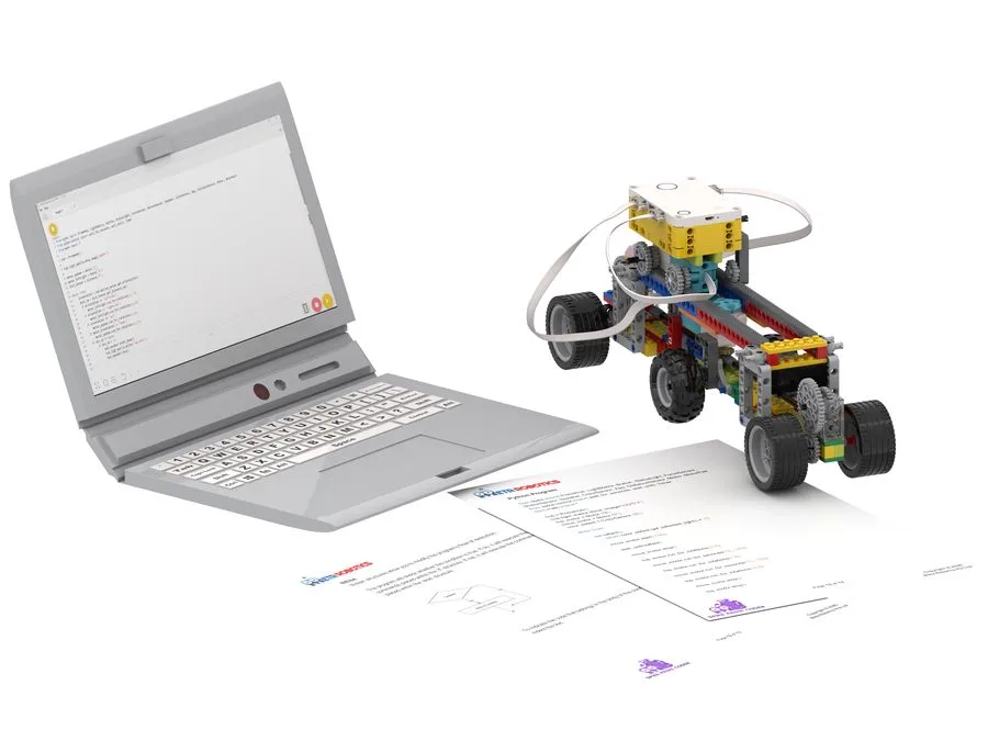 SPIKE Prime Coder robot with a laptop and learning worksheets