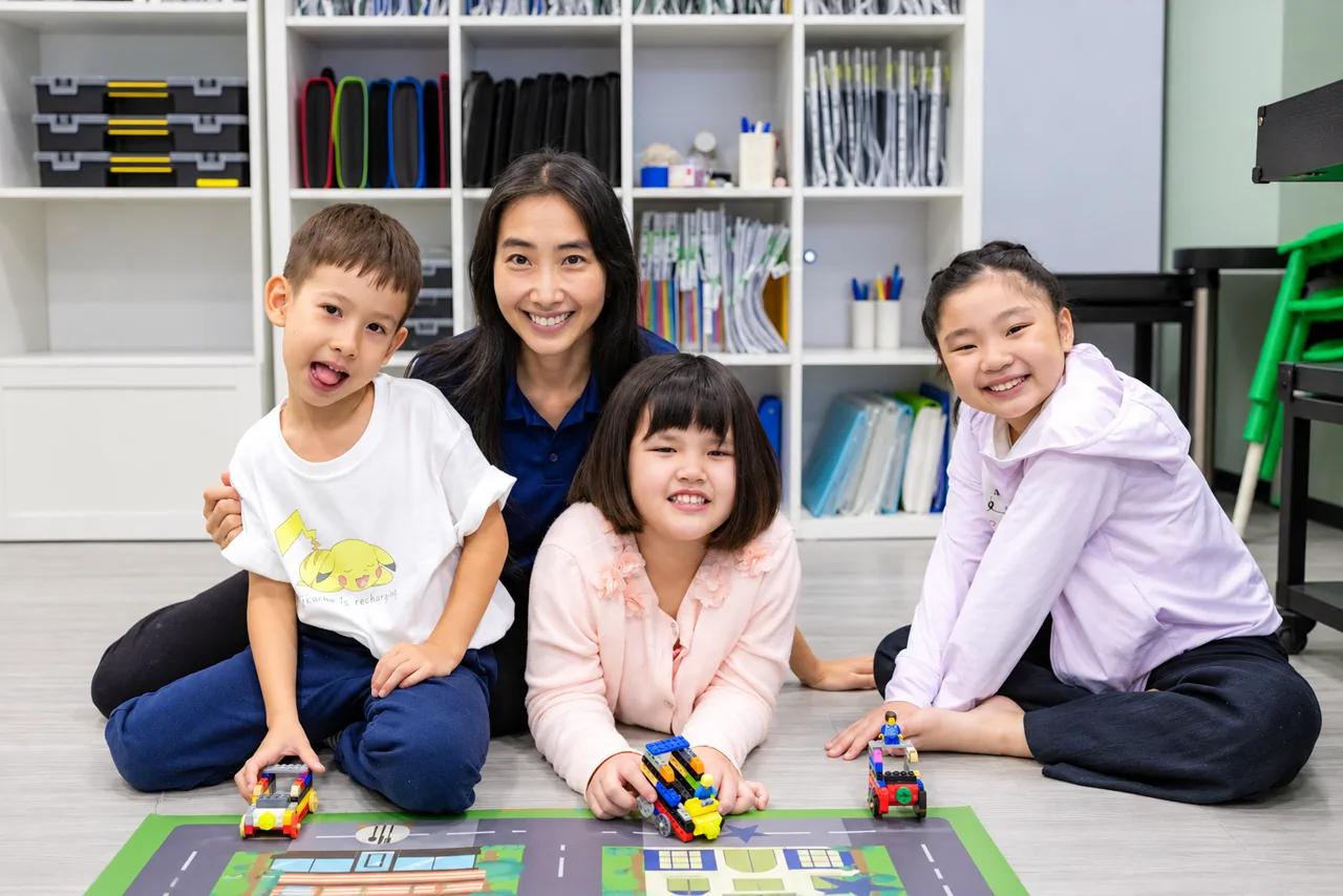 Children enjoying a hands-on robotics activity at Meta Robotics