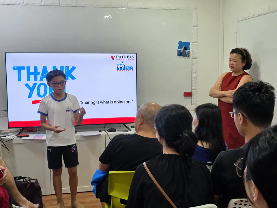 Student explaining a robotics portfolio